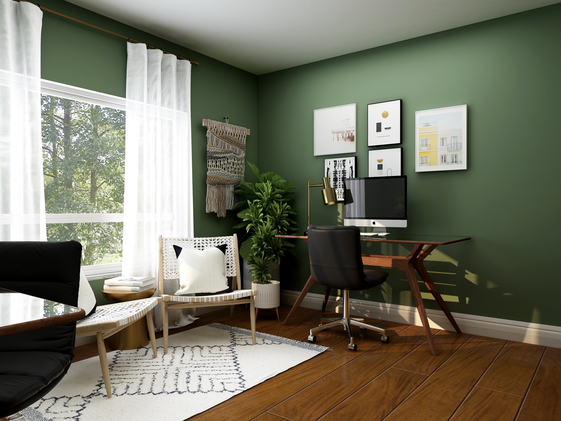 Photo of a home office space with the walls painted green.